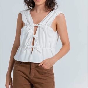 Bow tie front open back blouse
